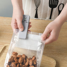 Load image into Gallery viewer, USB Charging Sealing Machine 2 In 1 Mini Heat Sealer Portable Handheld Sealing Machine Food Snack Plastic Storage Bag Rechargeable Sealer Packing Bag