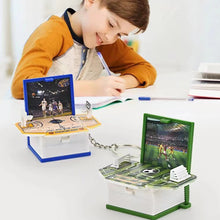 Load image into Gallery viewer, 3D Dinosaur Foldable Book Key Chain Toys Kids Pop Out Mini Book Astronaut Wacky Toys Trick Stress Relief Toy