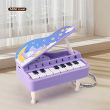 Load image into Gallery viewer, Mini Electronic Piano with Light Training Finger Piano Keychain Keyboard Piano Portable Musical Instrument Toy Key Ring