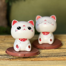 Load image into Gallery viewer, Cute Nod Head Solar Powered Lucky Fortune Cat Wealth Waving Figurines for Home Decorations for Car Decorations and for Gift