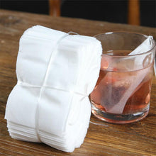 Load image into Gallery viewer, 100pcs Disposable Tea Bags with String Heal Seal Non-woven Fabric Tea Filter Bag for Herb Loose Tea Teaware Spice Filter Bag
