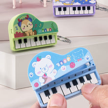 Load image into Gallery viewer, Mini Electronic Piano with Light Training Finger Piano Keychain Keyboard Piano Portable Musical Instrument Toy Key Ring

