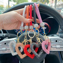Load image into Gallery viewer, Car Hollow Love Out Ceramic Clay Full Diamond Key Chain Leather Rope Sticking Water Diamond Key Pendant Simple
