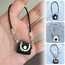 Load image into Gallery viewer, Dollhouse Mini Model Camellia Black and White Bag Hanging Neck Accessories Doll Pendant Accessories
