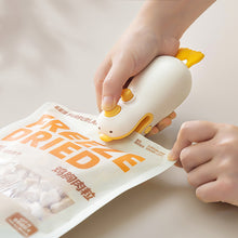 Load image into Gallery viewer, Mini Sealing Machine for Cutting and Sealing Small Yellow Duck with Magnetic Suction Portable Fast Heating USB Hot Pressing for Snack Sealing
