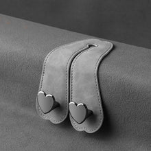 Load image into Gallery viewer, Car Seat Headrest Hooks 2 in 1 Leather Heart Shape Metal Back Hook Purse and Bag Backpack Double Hook Seat Hanger
