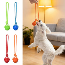 Load image into Gallery viewer, Solid Rubber Rope Ball Dog Toy Bite Resistant Chew Ball with Rope Handle for Interactive Tug of War &amp; Outdoor Fetch Training Toy for Medium Large Dogs
