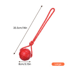 Load image into Gallery viewer, Solid Rubber Rope Ball Dog Toy Bite Resistant Chew Ball with Rope Handle for Interactive Tug of War &amp; Outdoor Fetch Training Toy for Medium Large Dogs
