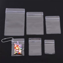 Load image into Gallery viewer, PVC Offset Hole Transparent Storage Bag Anti Oxidation Jewelry Sealed Bag Keychain Packaging Hole Design Pouch
