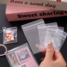 Load image into Gallery viewer, PVC Offset Hole Transparent Storage Bag Anti Oxidation Jewelry Sealed Bag Keychain Packaging Hole Design Pouch

