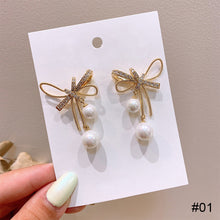Load image into Gallery viewer, Cutout Bow Pearl Pendant Stud Earrings Bow Diamond Earrings Creative Simple Accessories Jewelry for Women
