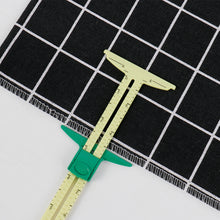 Load image into Gallery viewer, 5-in-1 Multi-functional Sliding Gauge Measuring Sewing Tool Quilting Tools Patchwork Ruler Cloth Cutting Drawing Rulers Tailor Home Use Accessories
